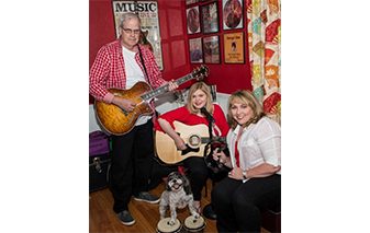 Magazine photo of family for the Chinn Guitar Project.